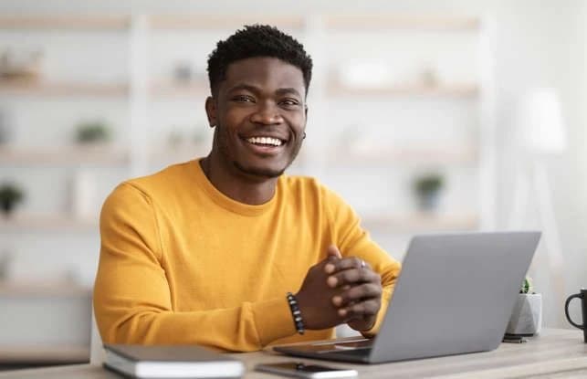 Professional holding a tablet in a bright workspace